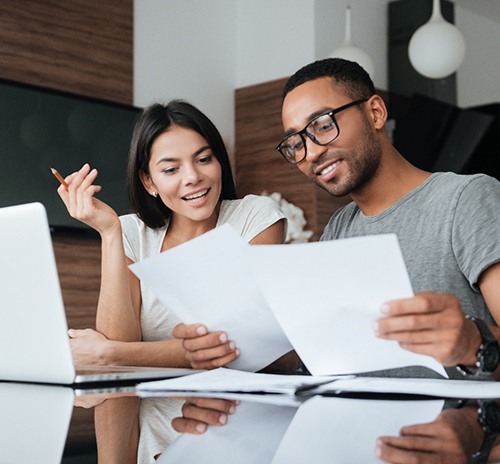 two adults looking over their finances together