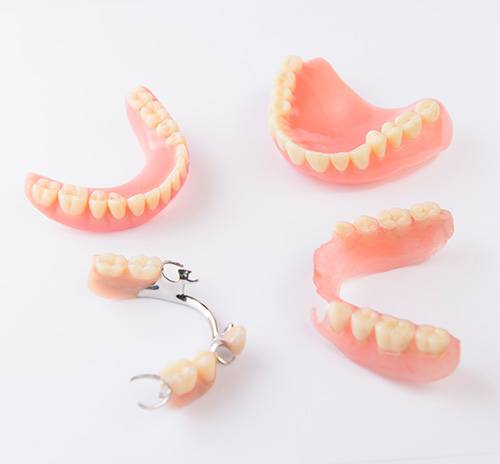 Various types of dentures on a table