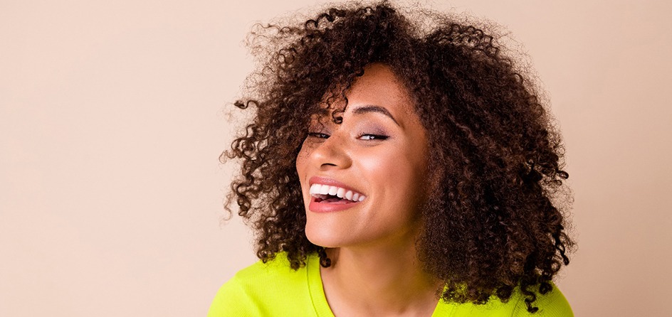 Young woman smiling with veneers in Jackson