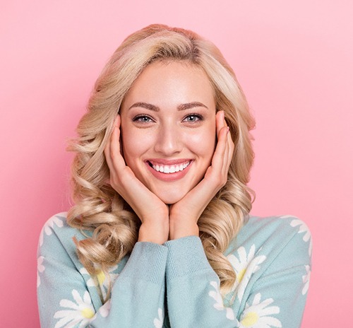 Woman with flower blouse smiling with veneers